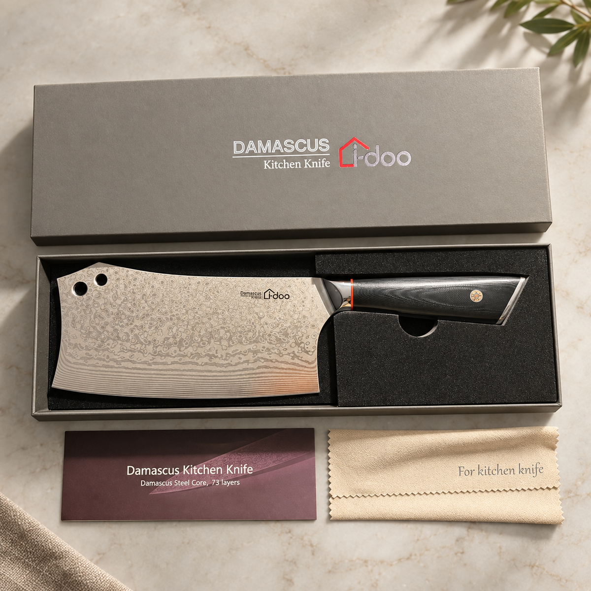 Overhead view of the Summit bone chopper gift set on a light stone surface