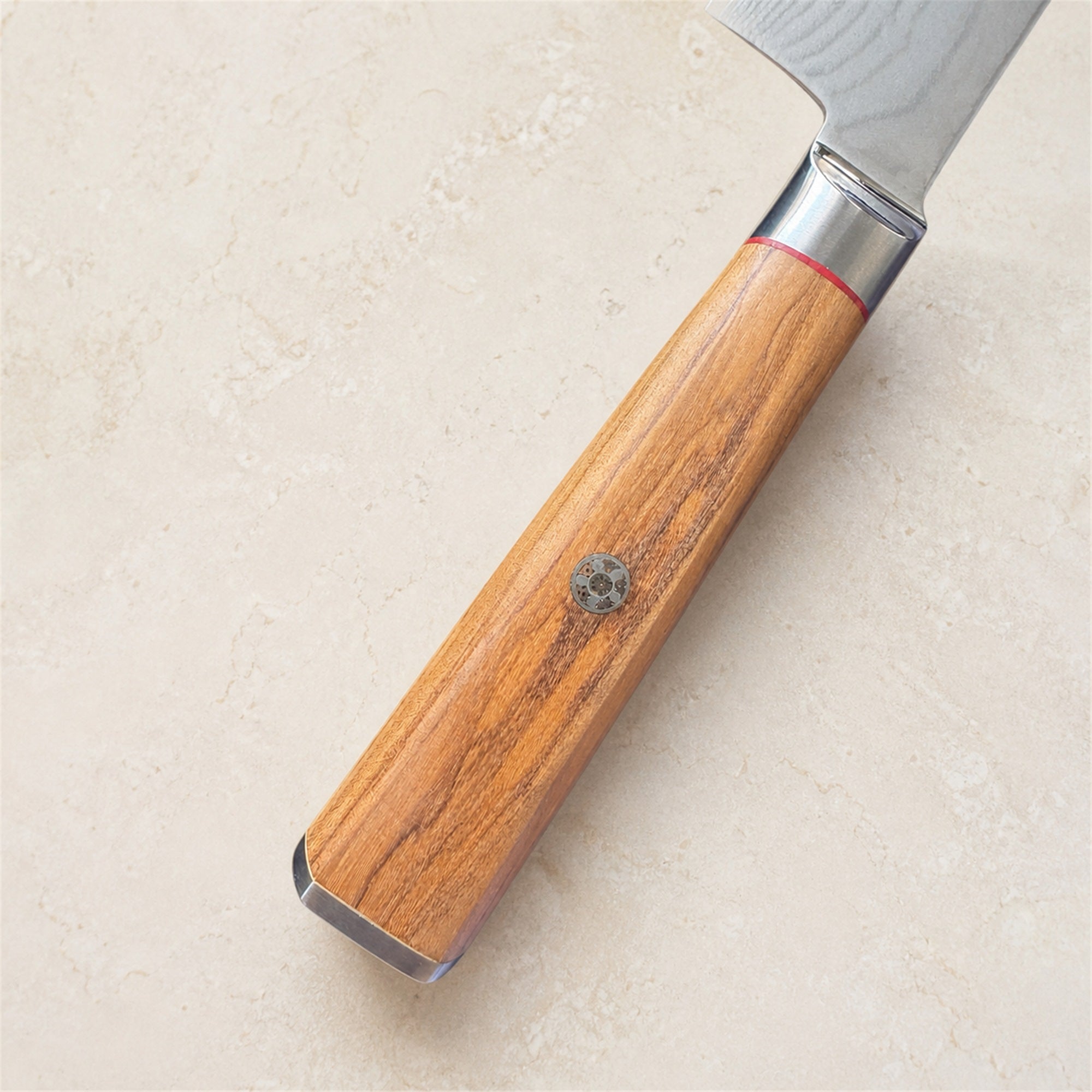 Close-up of the olive wood handle on the i-DOO Bondi Series chef’s knife