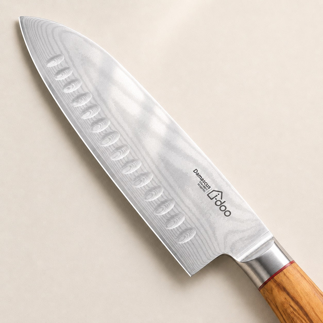 Damascus blade and scalloped detail of the i-DOO Bondi Santoku knife