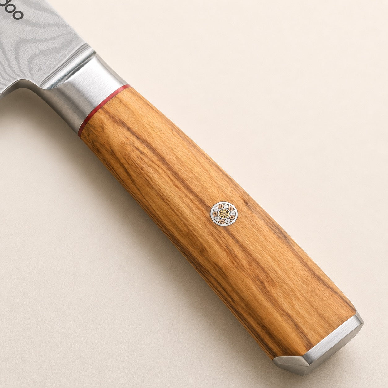 Natural olive wood handle detail of the i-DOO Bondi Santoku knife