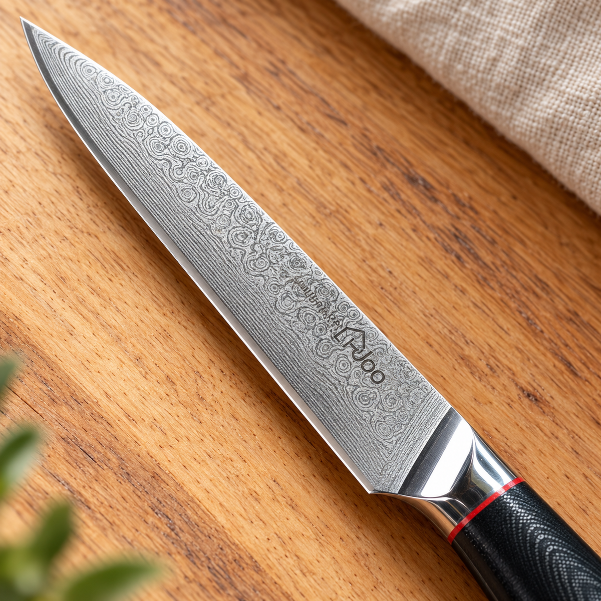 i-DOO five-inch utility knife Damascus blade, tip, cutting edge and polished bolster detail