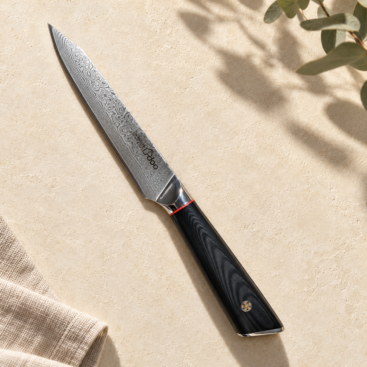 Complete i-DOO five-inch black-handle utility knife profile in warm natural window light