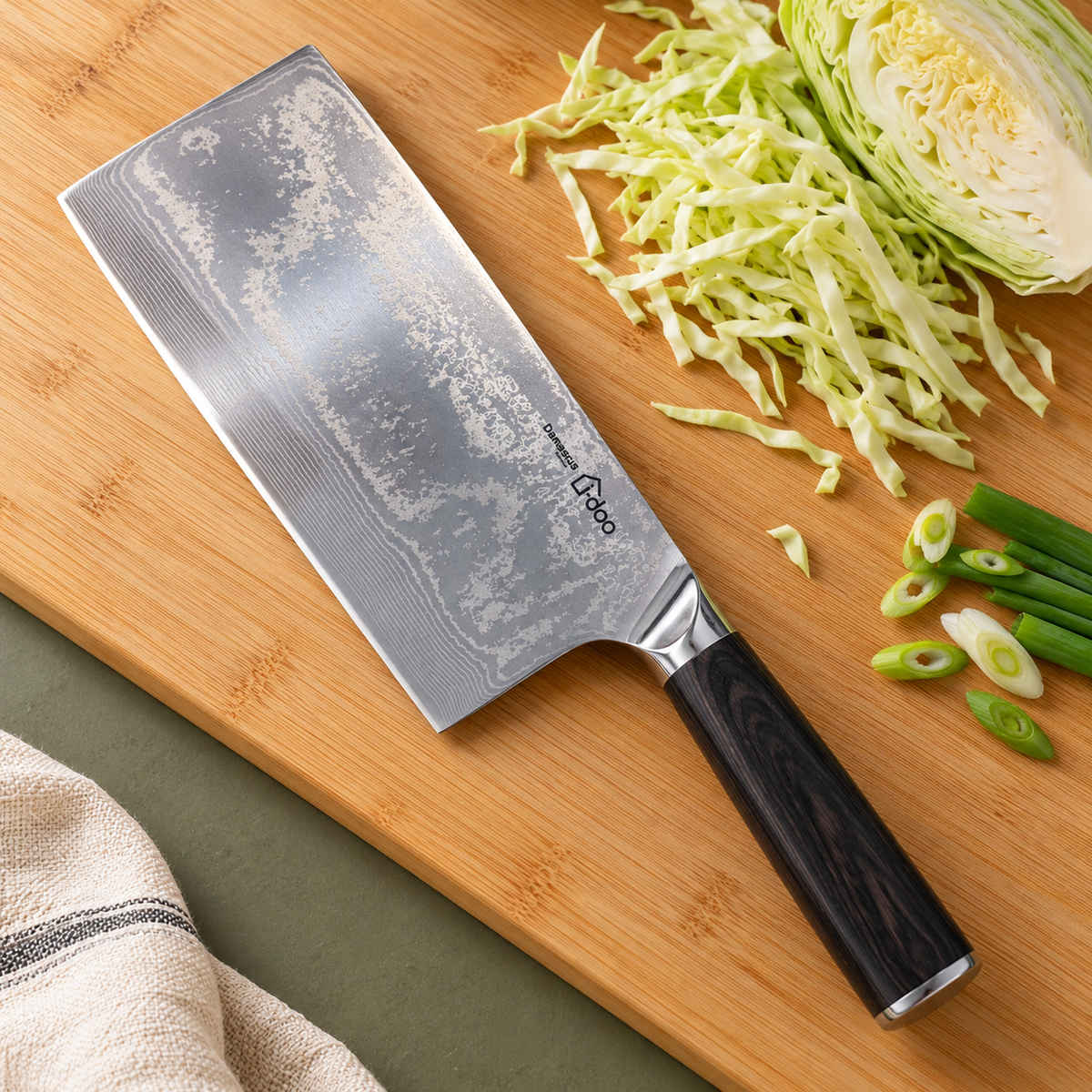 HJ broad kitchen knife beside sliced cabbage and spring onions