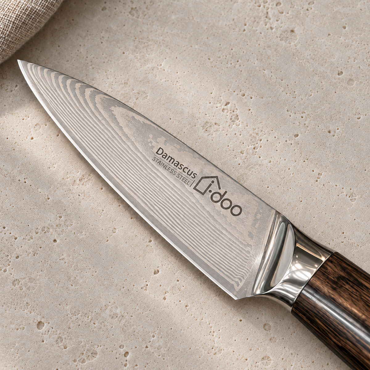 Close-up of the HJ paring knife blade pattern, i-doo engraving and polished bolster