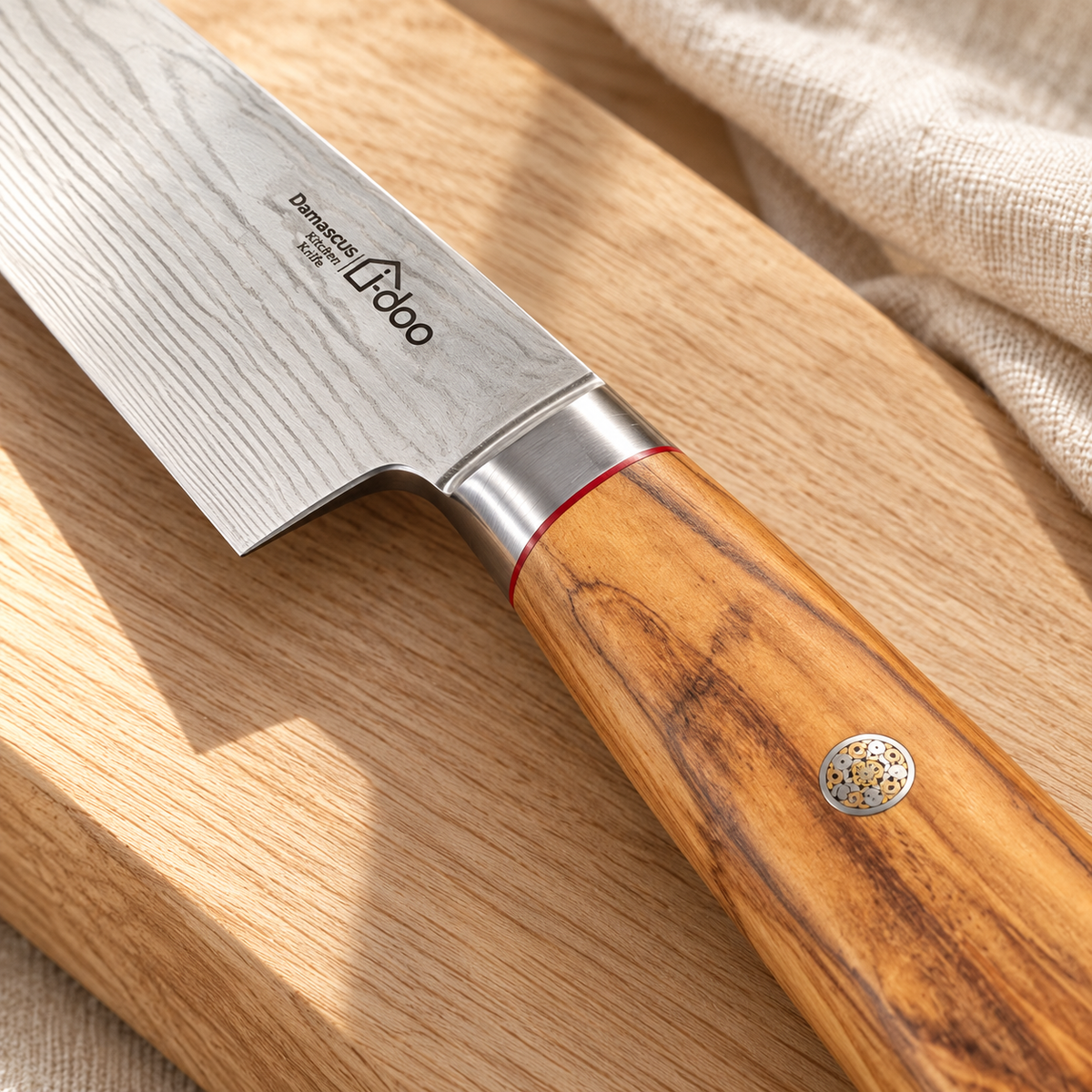 Olive wood handle, mosaic pin and polished bolster detail of i-DOO Kiritsuke